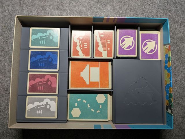 Railway Boom insert: printed card holders and a lidded token box filling the game box